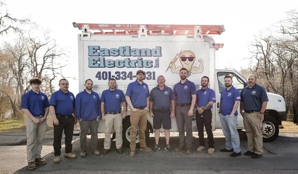The Eastland Electric team standing in front of their company box truck