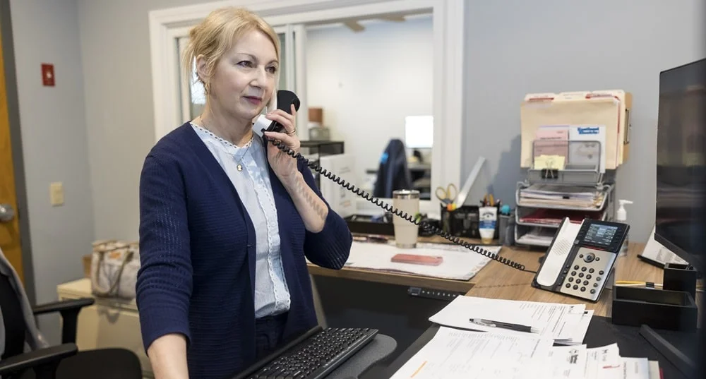 Eastland accountant Lee Anne, on the phone with a customer