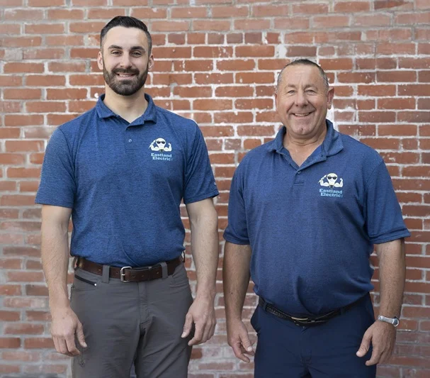 Owners Tom and Gregg Miller headshots in front of a brick building